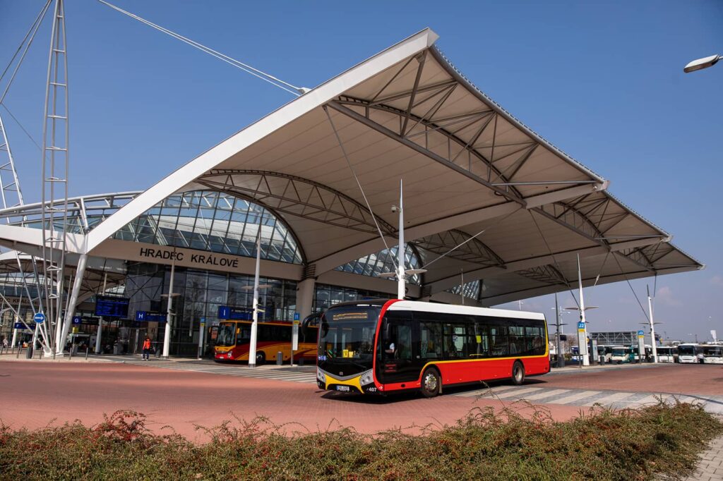 An electric bus passing by the long-distance stops at the Public Transport Terminal