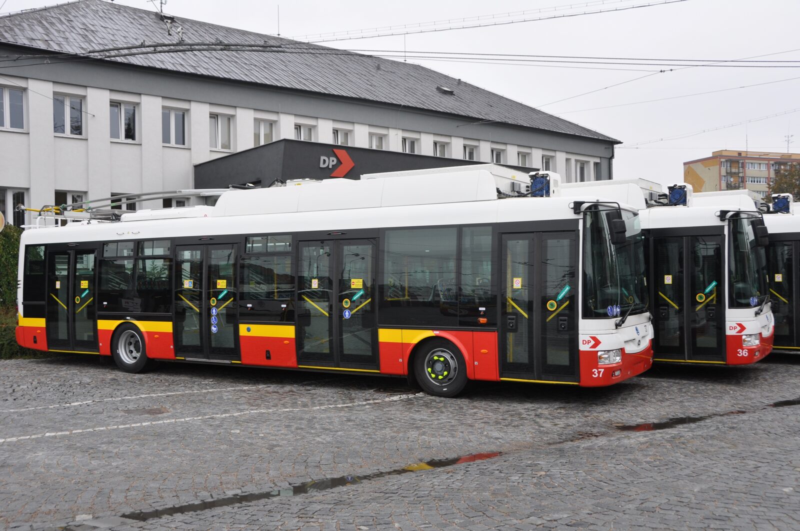 Parked trolleybuses Škoda 30 TR SOR in front of the control room