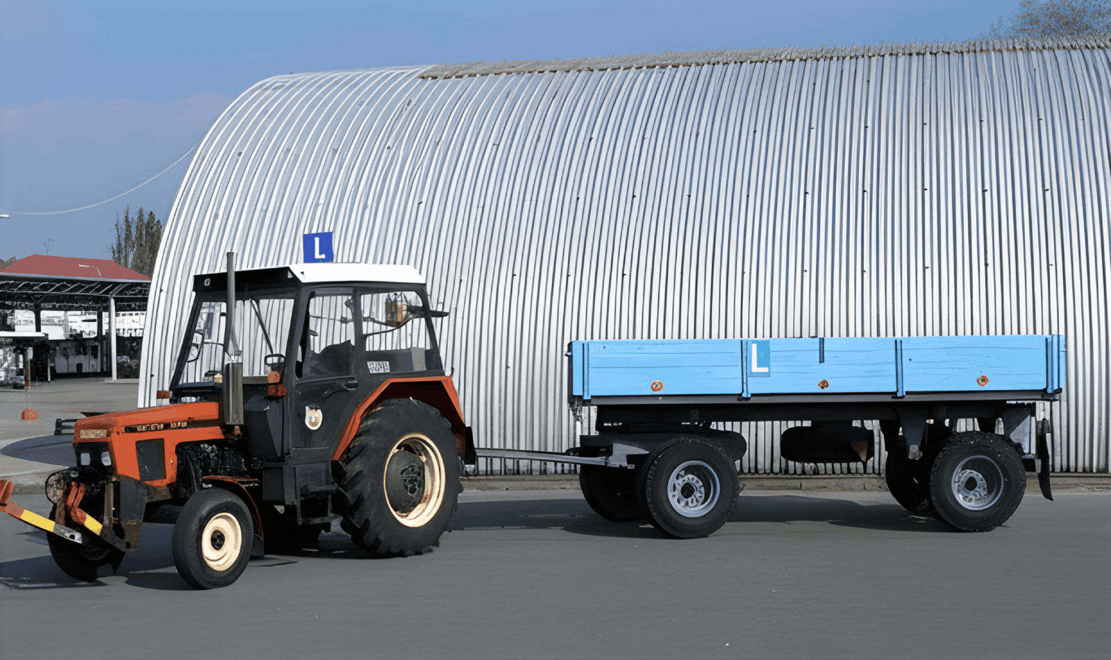 Driving school vehicle - tractor with trailer in the parking lot