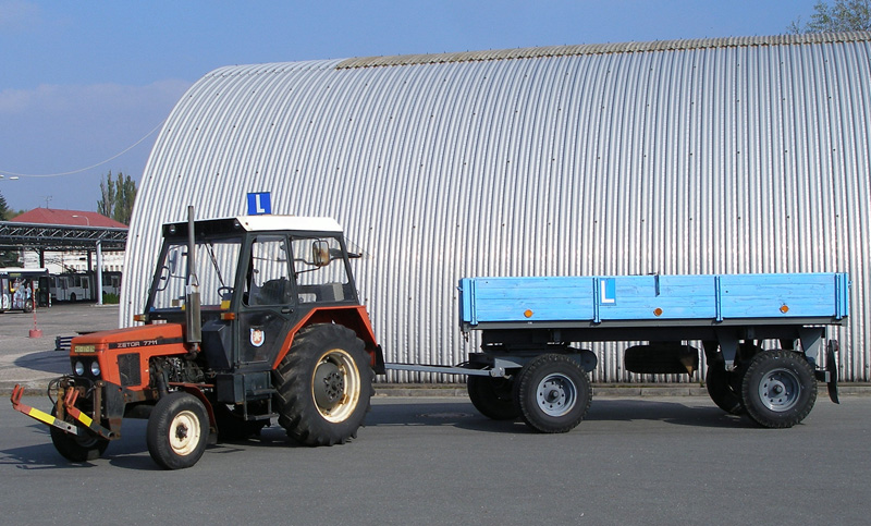 Driving school vehicle - tractor with trailer in the parking lot