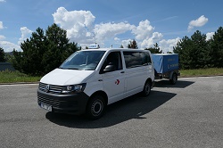 Driving school vehicle - Volkswagen van with trailer in the parking lot