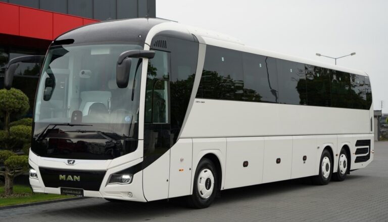 MAN R08 tour bus in a parking lot on a tour.